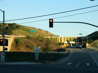 Rather than a freeway entrance shield assembly, the entrance signage for the California 73 (San Joaquin Hills Transportation Corridor) south uses the toll road logo with the words "San Joaquin Hills" and a separate placard for "Toll Road."