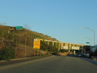 After the signalized intersection with El Toro Road (CR S-18), all traffic will connect onto California 73 (San Joaquin Hills Transportation Corridor) south. The left lane is for FasTrak (electronic toll collection), and the right lane is for cash toll collection.