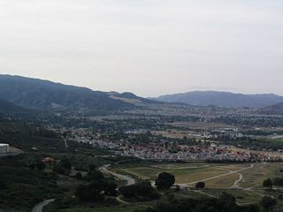 Many tract homes that look similar from a distance are visible from California 74 at the top of Cariso Grade.