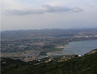 The city of Lake Elsinore, with its grid street pattern and hundreds of houses, lies at the north shore of the lake as seen from this vantage point from the top of Cariso Grade.