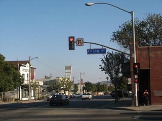 D Street is a former alignment of U.S. 395 and could have been a business loop for Interstate 215. The city of Perris uses blue signs to mark the traffic signal intersections, and this back-lit blue blade is posted with a blue California 74 shield.