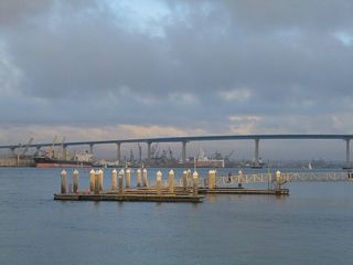 From Coronado Ferry Landing, the San Diego-Coronado Bay Bridge arcs across the bay between Coronado and the shipyards of Barrio Logan.