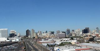 Looking north from the San Diego Coronado Bay Bridge westbound lanes is this view of downtown San Diego. Harbor Drive (Old U.S. 101) is the four-lane roadway that can be seen traveling north past the San Diego Convention Center and Petco Park (Home of Major League Baseball's San Diego Padres).