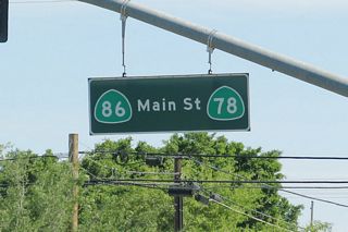 Main Street in western Brawley was signed as both California 78 and California 86. In 2012, California 78 was rerouted onto the Brawley Bypass, leaving California 86 on Main Street. However, in 2013, this street blade guide sign was still posted at the intersection of Main Street and Western Avenue, one block west of California 86 (First Street).