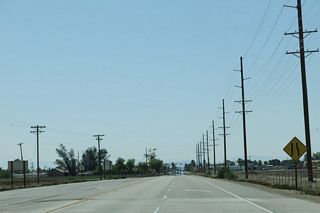 Traveling through Downtown Brawley, California 78 was rerouted onto the Brawley Bypass in October 2012. As a result, the old alignment is known solely as Main Street and to date has not been designated officially as a business route. Here, westbound Main Street proceeds toward downtown Brawley after its intersection with California 78 and California 111.