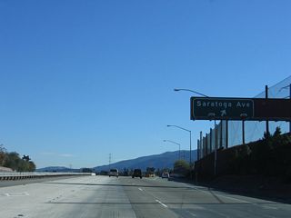 Southbound California 85 (West Valley Freeway) reaches Exit 14, Saratoga Avenue.