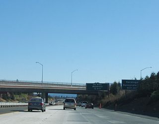 Southbound California 85 (West Valley Freeway) approaches Exit 16, De Anza Boulevard. Use De Anza Boulevard south to Saratoga-Sunnyvale Road south to the city of Saratoga and California 9/Big Basin Way south to Big Basin Redwoods State Park.