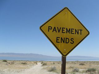 Near Desert Shores in Imperial County, some roads lose their pavement just before reaching the shores of the Salton Sea. A large "pavement ends" sign is posted prior to the ever-changing shoreline of the Salton Sea.