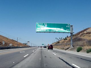 The next three exits on California 87 (Guadalupe Parkway) are: Exit 3, Curtner Avenue; Exit 5, Interstate 280 (Sinclair Freeway); and Exit 6, Auzerais Street, California 82 (West San Carlos Street), Santa Clara Street, and Julian Street (all four streets under Exit 6 are served by a collector distributor lane arrangement with multiple off-ramps through downtown San Jose).