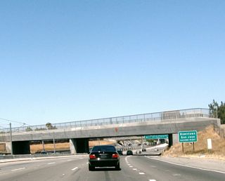 Use Exit 6 (Auzerais Street, California 82 (West San Carlos Street), Santa Clara Street, and Julian Street) to downtown San Jose, including the Guadalupe River Park (via California 82 south/east), The Alameda (via Santa Clara Street west), Childrens Discovery Museum (via Auzerais Street), San Jose State University (via California 82 east), Plaza de Cesar Chavez (via California 82 east), HP Pavilion at San Jose (via Santa Clara Street west), and the Santa Clara County Route Courthouse (via Julian Street east).