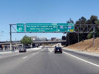 Northbound California 87 (Guadalupe Parkway) reaches Exit 5, Interstate 280 (Sinclair Freeway). The downtown San Jose interchange (Exit 6, Auzerais Street, California 82 (West San Carlos Street), Santa Clara Street, and Julian Street) is next.