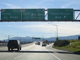 Southbound California 87 (Guadalupe Parkway) reaches Exit 1C, Santa Teresa Boulevard south. The next exit is Exit 1B, California 85 (West Valley Freeway) north to Cupertino. The two left lanes will transition directly onto Exit 1A, California 85 (West Valley Freeway) south.