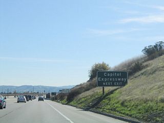 The Capitol Expressway begins at the Santa Clara County Route G-8 (Almaden Expressway) interchange west of here, then travels east and then north in an arc. The expressway crosses U.S. 101 at Exit 382, then turns north to join Interstate 680 at Exit 1C. Unlike most expressways in San Jose, the Capitol Expressway has no signed county route designation.
