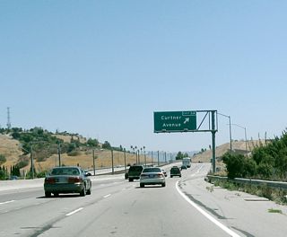 A new overhead for Curtner Avenue was installed with an exit number between 2004 and 2007.