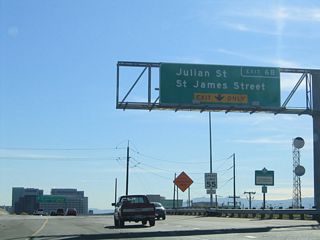 The next exit along California 87 (Guadalupe Parkway) south is Exit 6B, Julian Street. Note the 55 miles per hour speed limit, which is lower than most other San Jose-area freeways. Downtown San Jose skyscrapers come into view on both sides of the freeway. To the west of the freeway via the Julian Street exit is the HP Pavilion at San Jose. To the east of the freeway are hotels, bank buildings, San Jose State University, and Museum of Art; use Exit 6A (California 82) to the downtown area.