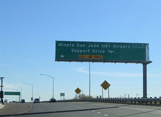 The right lane becomes exit only for Exit 8, Skyport Drive and Airport Parkway to the Norman Y. Mineta International Airport. The left two lanes continue south on California 87 along the Guadalupe River toward downtown San Jose.