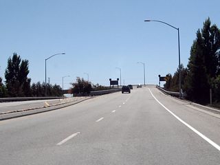 Two lanes carry southbound Guadalupe Parkway over the ramp from U.S. 101 south to California 87 south.