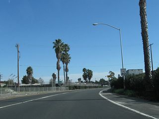 California 90 curves a bit to the southeast to reach its intended carriageway. The speed limit is set at 40 miles per hour.