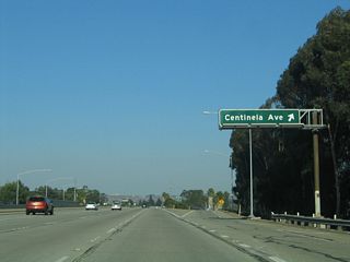 Eastbound California 90 (Marina Freeway) reaches Exit 1B, Centinela Avenue. This major north-south arterial travels north to serve the Del Rey and Mar Vista communities of Los Angeles as well as western Culver City along the Washington Boulevard corridor.