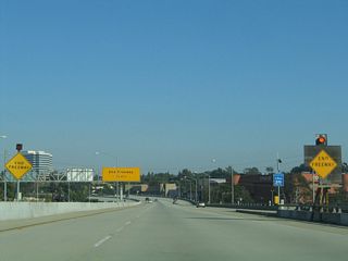 Leaving the Interstate 405 interchange, a pair of end freeway advance signs are posted along eastbound California 90.