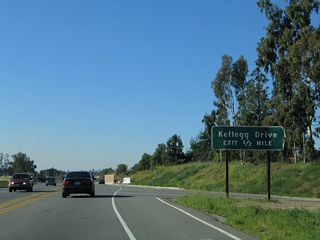 The next exit along California 90 (Imperial Highway / Richard M. Nixon Parkway) is with Kellogg Drive (one-half mile). The two-lane freeway used widen to four lanes at this point.