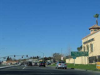 Westbound California 90 (Imperial Highway), which is generally headed northwest, approaches the intersection with Yorba Linda Boulevard in Yorba Linda.