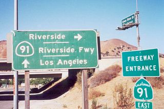 California 91 freeway entrance signage at the former Exit 42/Coal Canyon Road interchange. The Coal Canyon Road interchange was closed in 2003 to allow for a wildlife undercrossing. Since the exit was designed for local access and does not attach to other highways or city streets, the closure was relatively easy to accomplish. Note that this sign has the "Riverside Freeway" designation on it, which is fairly uncommon today. Of course, as of 2003, these signs were removed once the exit was closed.