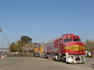 On the grounds of the Harvey House are several old locomotives and cabooses that are no longer in use; they positioned around the Harvey House adjacent to the Burlington Northern Santa Fe (BNSF) Railyard in Barstow.
