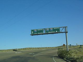 A trumpet interchange joins Old Highway 58 with Interstate 15. U.S. 91-466 historically followed I-15 east to Yermo then northeast toward Baker and Las Vegas.