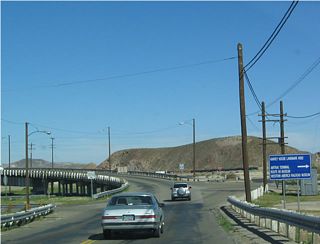Northbound Historic U.S. 91 (First Avenue) at the turn off for the Harvey House, U.S. 66 Historic Museum, Western America Railroad Museum and train depot.
