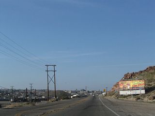 After the Irwin Road intersection, southbound Historic U.S. 91 (First Avenue) approaches the main Mojave River crossing that carries the former U.S. highway into downtown Barstow.