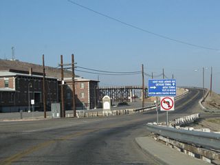 A right turn to Crooks Avenue is required to make the link to the Railroad Depot, which includes the Harvey House (Casa del Desierto), Route 66 Museum (open since July 4, 2000), Western America Railroad Museum, and Amtrak / Greyhound Terminal. First Avenue continues south across the railroad yard to Downtown Barstow and Historic U.S. 66 (the Main Street of America).