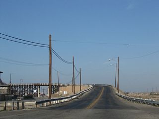 Historic U.S. 91 (First Avenue) previously ascended across the Old Iron Bridge, which opened on April 26, 1930.
