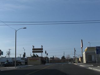 Historic U.S. 91 (First Avenue) south at Business Loop I-15 and Historic U.S. 66 (Main Street) in Downtown Barstow. U.S. 66 east continues across Barstow to I-15 and Interstate 40 east. The historic route of U.S. 91 comibines with old U.S. 66 southwest to Victorville and San Bernardino.