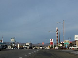 The Baker Thermometer comes into view where Baker Boulevard intersects SR 127 (Death Valley Road). Kelbaker Road extends south from the exchange joining SR 127 and Interstate 15 to Kelso.