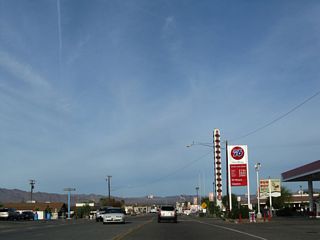 Continuing past the four-way intersection with SR 127 in Baker, northbound Historic U.S. 91-466 proceeds past several restaurants, gas stations and motels.