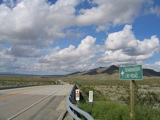 Leading north from a diamond interchange (Exit 133) with Interstate 40, U.S. 95 and Historic U.S. 66 travel toward the west of the Dead Mountains.
