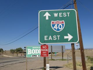 U.S. 95/Historic U.S. 66 (Broadway Avenue) enter a diamond interchange (Exit 144) with Interstate 40 north of San Clemente Street.