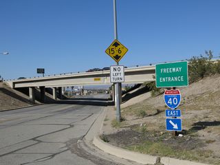 Interstate 40 follows the Colorado River southeast from Needles to cross the state line at Topock, Arizona. I-40 curves northeast around the Black Mountains from there to Kingman.