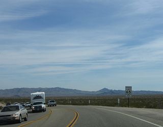U.S. 95 and Historic U.S. 66 arc 6.4 miles southeast from Arrowhead Junction to Interstate 40.