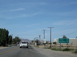 This mileage sign, found along northbound U.S. 95 (Intake Boulevard) after the intersection with Business Loop I-10 (Hobson Way), provides the distance to Vidal Junction (40 miles) and Needles (96 miles). Services are limited along U.S. 95 between Blythe and Needles.