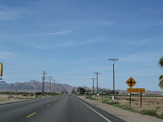 Northbound U.S. 95 (Intake Boulevard) approaches Riverside Avenue (Chanslor Way). This east-west road provides local access within the valley. Turn right to the fairgrounds.