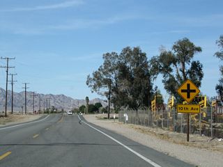The next marked intersection along northbound Intake Boulevard is with 10th Avenue; the numbered avenues decrease along U.S. 95 north through the agricultural valley.