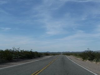 The low point in Chemehuevi Valley is Chemehuevi Wash, and U.S. 95 ascends from there to Lobecks Pass (el. 1,520 feet). The Colorado River flows between 15 and 20 miles to the east.