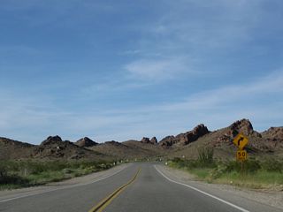Continuing to ascend toward Lobecks Pass, U.S. 95 shifts northeast to pass through the Sawtooth Range.
