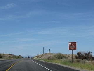 U.S. 95 enters the unincorporated community of Colorado River Communities. For the next 15-20 miles, U.S. 95 closely parallels the west bank of the Colorado River. Several resorts, marinas, and homes line this section of the river.