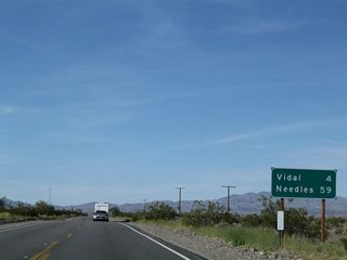 This mileage sign provides the distance to Vidal (four miles) and Needles (59 miles).