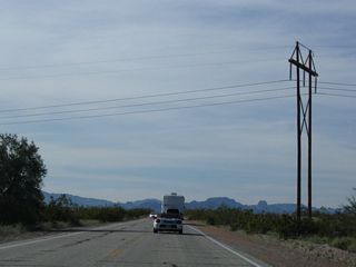 A high-voltage power line spans U.S. 95 from the power plant west of Blythe north and then west to Parker Dam. 