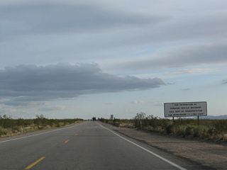 U.S. 95 leaves the Silver State of Nevada and enters the Golden State of California through Piute Valley. A regulatory sign advises motorists about operating oversize vehicles in California.