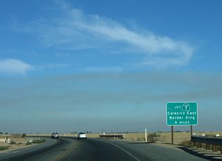 This sign advises of the California 7 junction, which offers a route south into Mexico via the Calexico East Port of Entry. Commercial vehicles must use California 7 south.